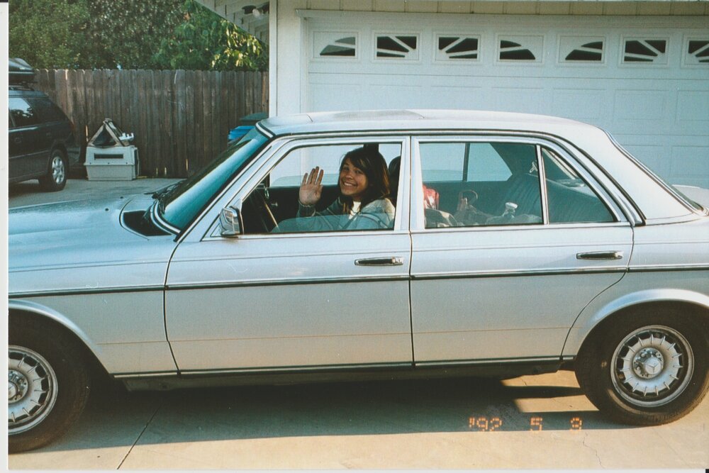 Ivy beside her vegetable-oil-powered car